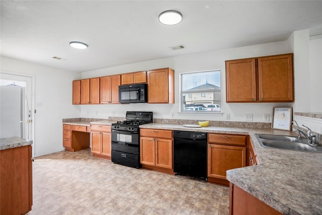 kitchen featuring sink and black appliances