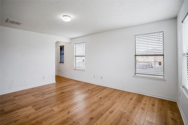 unfurnished room featuring light wood-type flooring