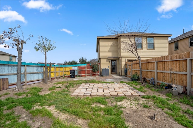 back of house featuring central AC and a patio area