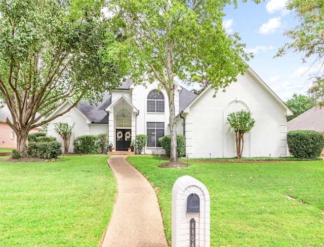 view of front of home with a front lawn