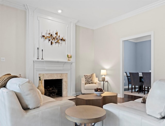 living room featuring crown molding, a fireplace, and hardwood / wood-style floors