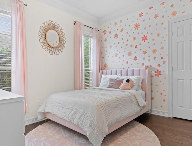 bedroom featuring crown molding and dark wood-type flooring