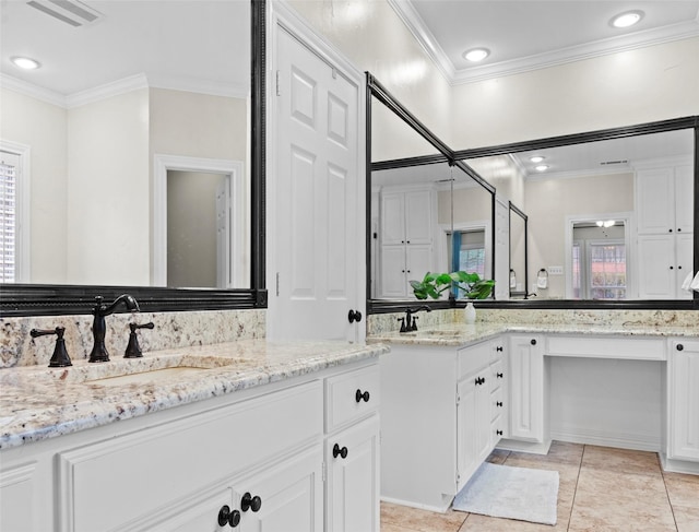 bathroom with ornamental molding, vanity, and tile patterned flooring