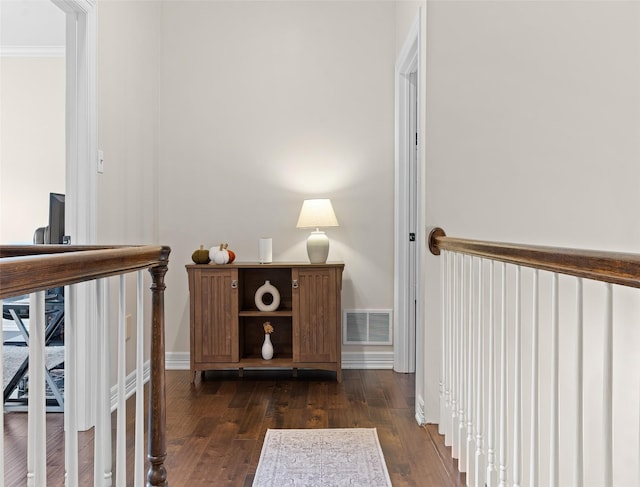 hallway with dark hardwood / wood-style flooring