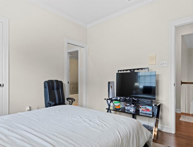 bedroom with crown molding and dark hardwood / wood-style floors