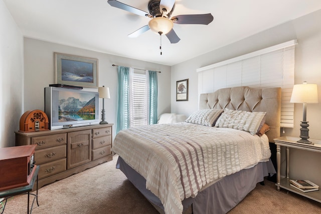 bedroom featuring a ceiling fan and light carpet