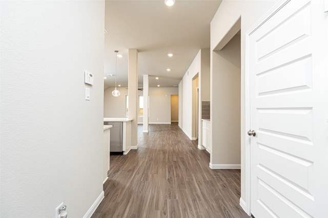 corridor with dark hardwood / wood-style floors