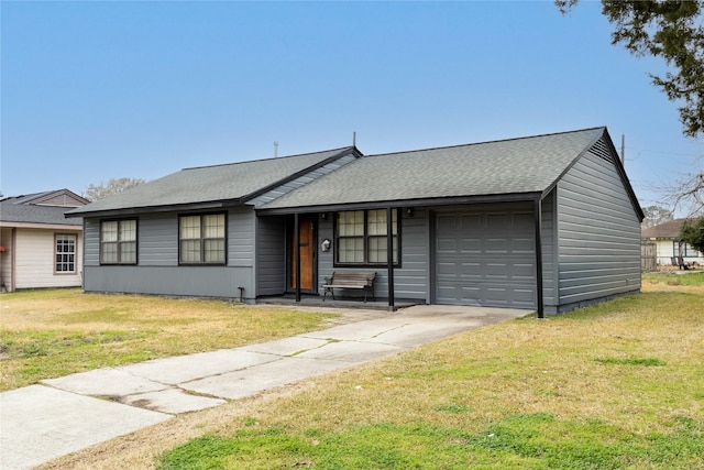 ranch-style home with a garage and a front lawn