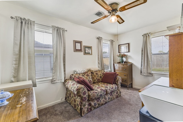 interior space with carpet floors, a wealth of natural light, and ceiling fan