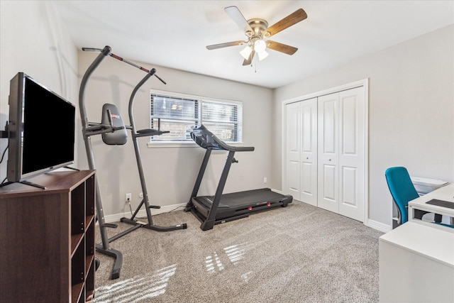 exercise area with ceiling fan and carpet flooring