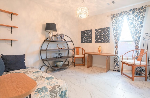 sitting room featuring a chandelier