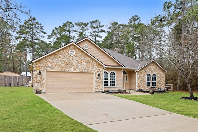 view of front of house with a garage and a front lawn