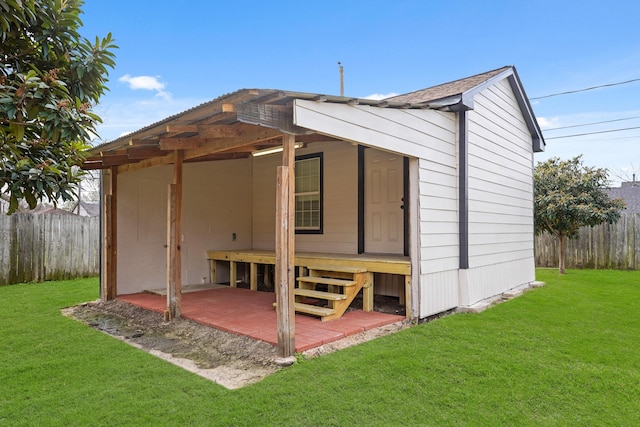 view of outbuilding with a lawn