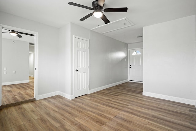 spare room featuring hardwood / wood-style floors and ceiling fan