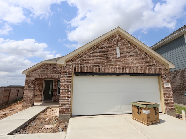 21666 Sandy Dune Dr, Cypress, TX 77433 - view of front of property with brick siding, concrete driveway, and a garage
