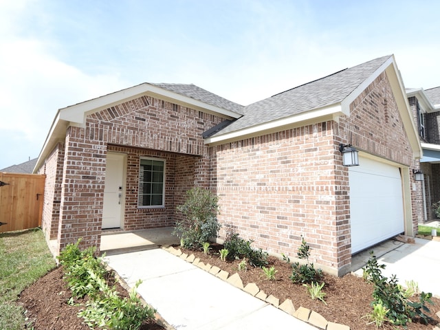 21666 Sandy Dune Dr, Cypress, TX 77433 - view of front of property with brick siding, an attached garage, and a shingled roof