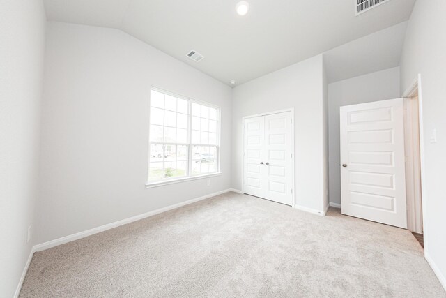 3013 Plains Cir, Brookshire, TX 77423 - unfurnished bedroom with visible vents, baseboards, a closet, carpet flooring, and lofted ceiling