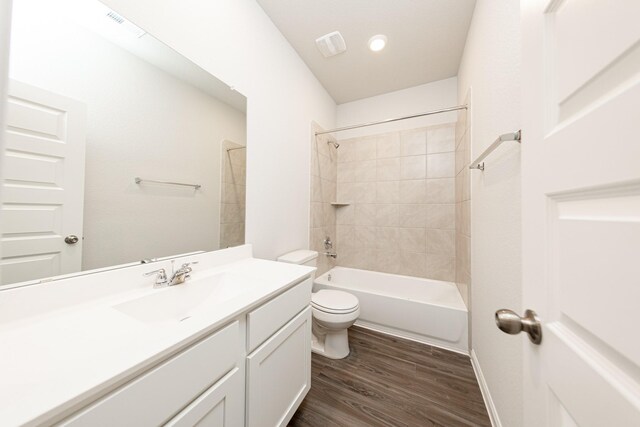 3013 Plains Cir, Brookshire, TX 77423 - bathroom featuring tub / shower combination, toilet, wood finished floors, and vanity