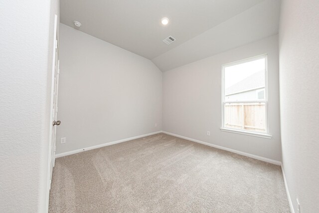 3013 Plains Cir, Brookshire, TX 77423 - carpeted empty room with visible vents, baseboards, and lofted ceiling