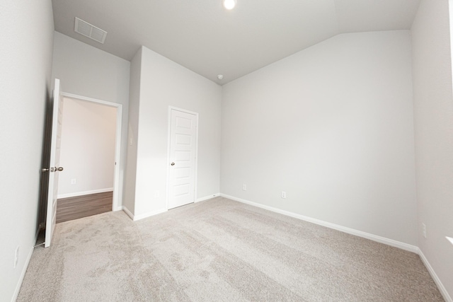 3013 Plains Cir, Brookshire, TX 77423 - unfurnished bedroom featuring visible vents, lofted ceiling, baseboards, and carpet flooring