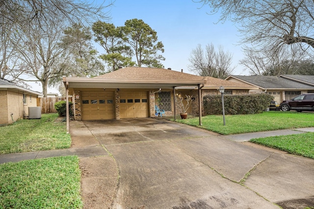 ranch-style home with a garage, a carport, cooling unit, and a front lawn