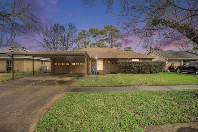 ranch-style house with cooling unit, a yard, and a carport