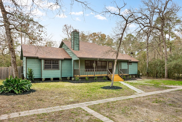 view of front facade with a porch and a front yard