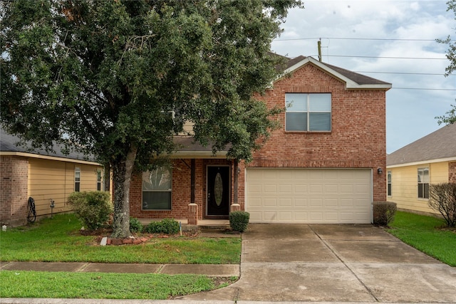 view of front facade with a garage and a front yard