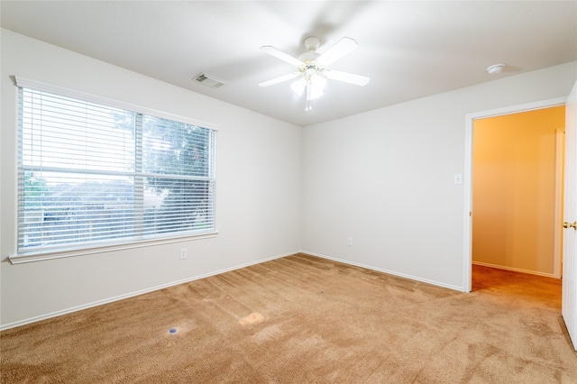 carpeted empty room with ceiling fan