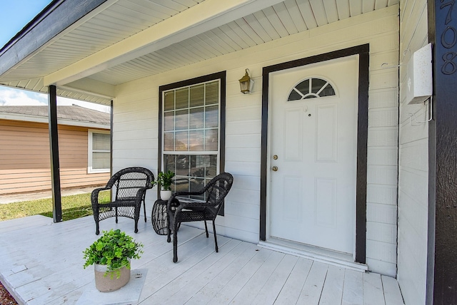 doorway to property with a porch