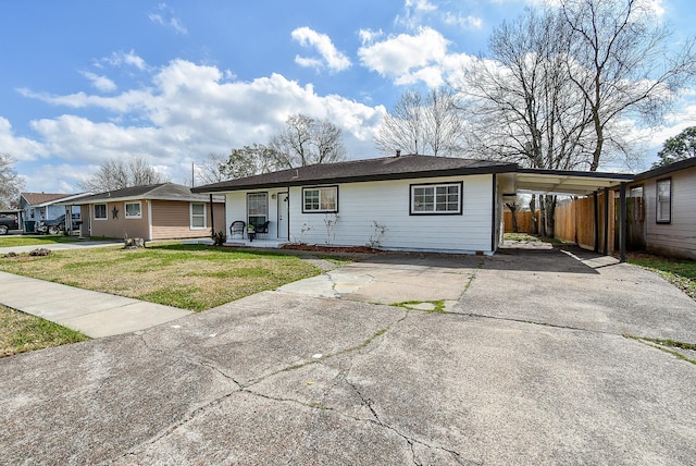 ranch-style house with a front lawn and a carport