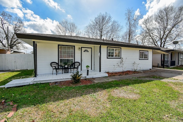 single story home featuring a porch and a front yard