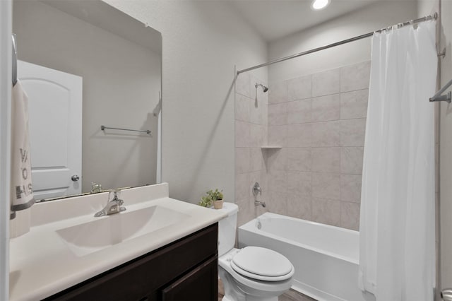 full bathroom featuring vanity, shower / bath combination with curtain, and toilet