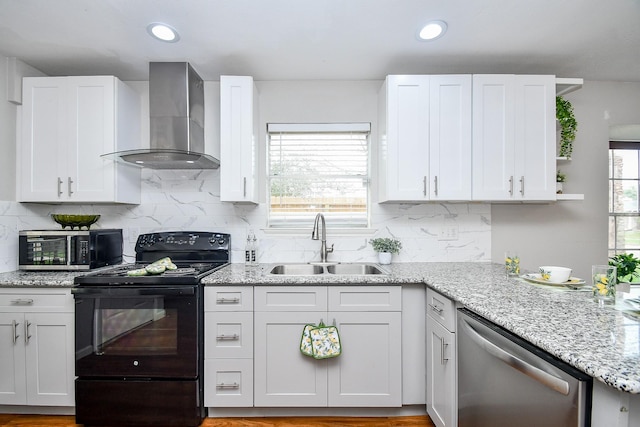 kitchen featuring sink, white cabinetry, black / electric stove, dishwasher, and wall chimney range hood