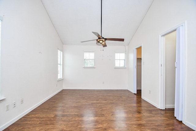 unfurnished room with lofted ceiling, dark hardwood / wood-style floors, and ceiling fan