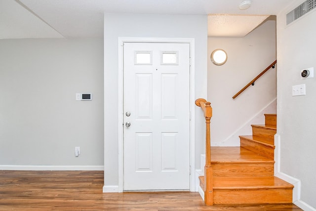 entrance foyer with hardwood / wood-style flooring