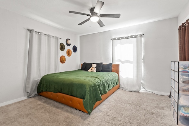 bedroom with light colored carpet and ceiling fan