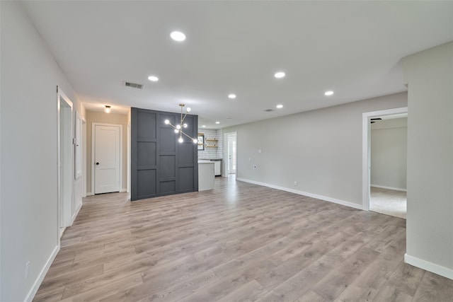 unfurnished living room featuring light hardwood / wood-style floors