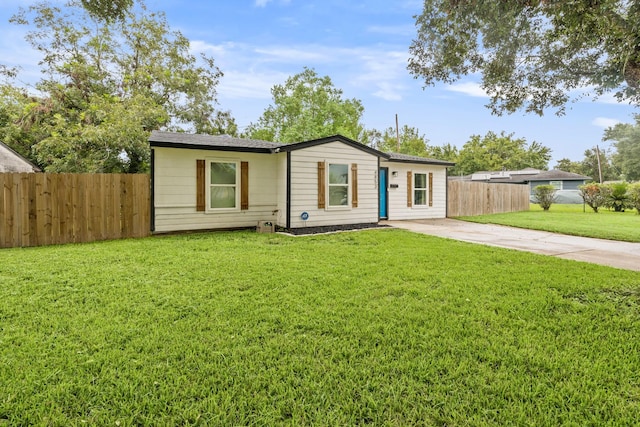 ranch-style house with a front lawn