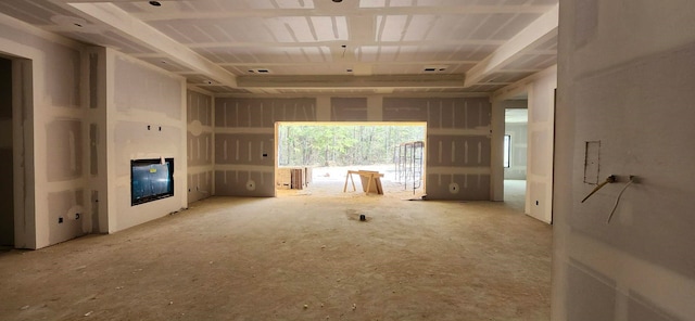 unfurnished living room with a glass covered fireplace