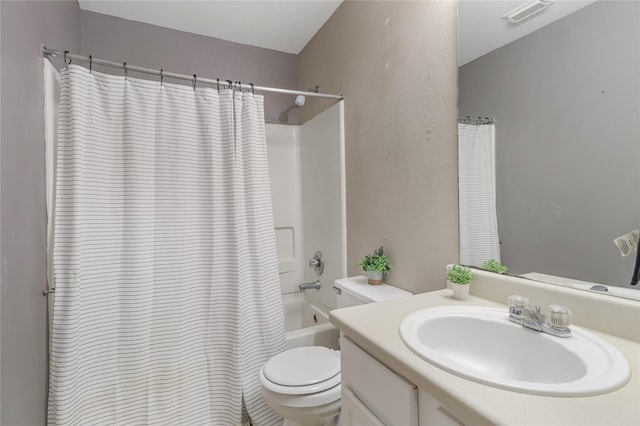 full bathroom featuring shower / tub combo with curtain, vanity, and toilet