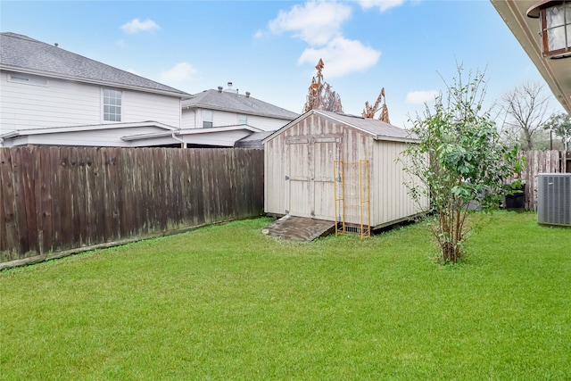 view of outbuilding featuring central AC and a lawn