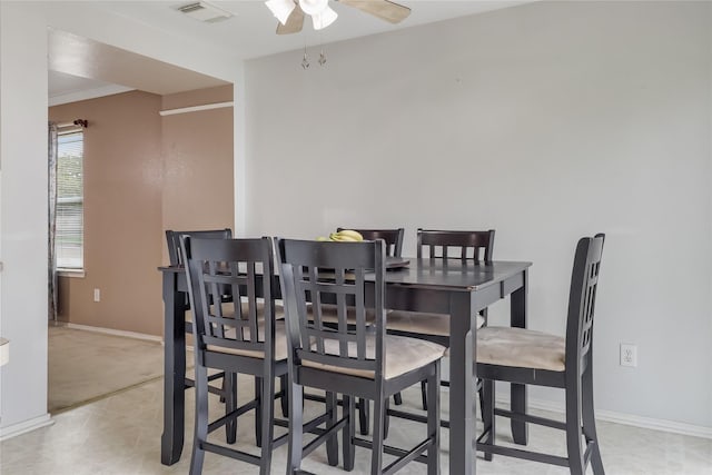 dining space featuring ceiling fan