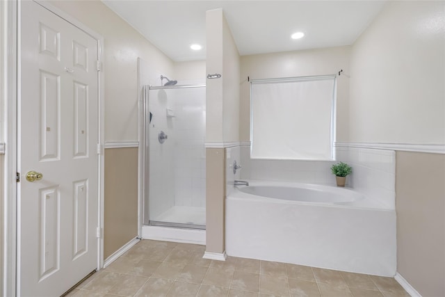 bathroom featuring separate shower and tub and tile patterned flooring