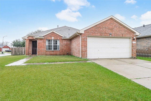 single story home featuring a garage and a front yard