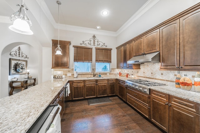 kitchen with crown molding, tasteful backsplash, dark hardwood / wood-style flooring, decorative light fixtures, and stainless steel gas stovetop