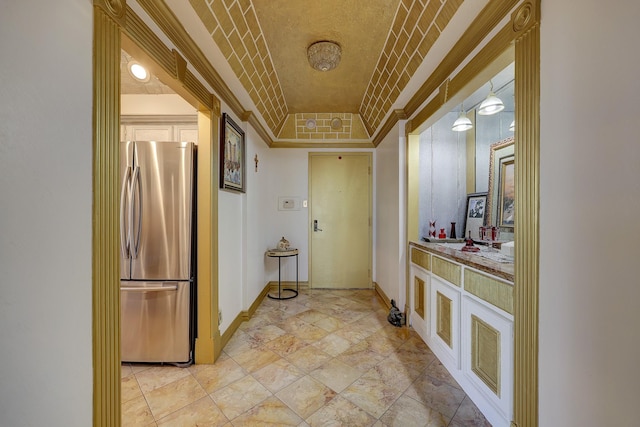 49 Briar Hollow Ln Unit 302, Houston, TX 77027 - hallway featuring baseboards, crown molding, and a raised ceiling