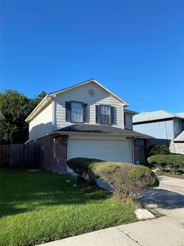 view of front facade with a garage and a front yard