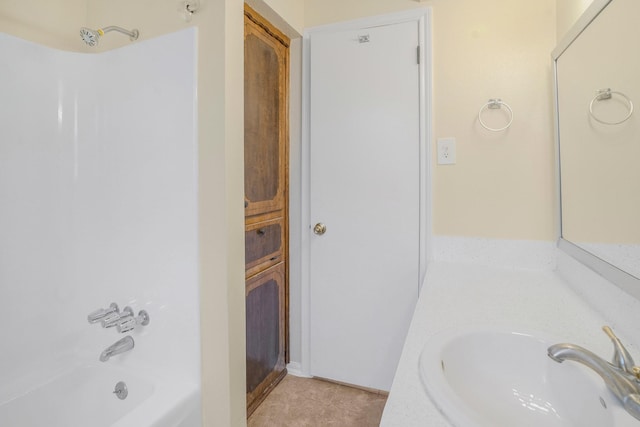 bathroom with washtub / shower combination, tile patterned floors, and vanity