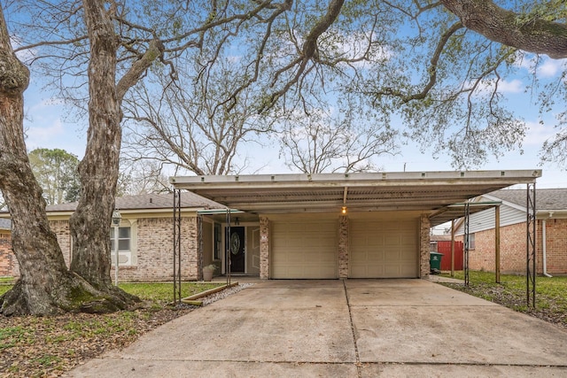 view of front of home with a garage and a carport